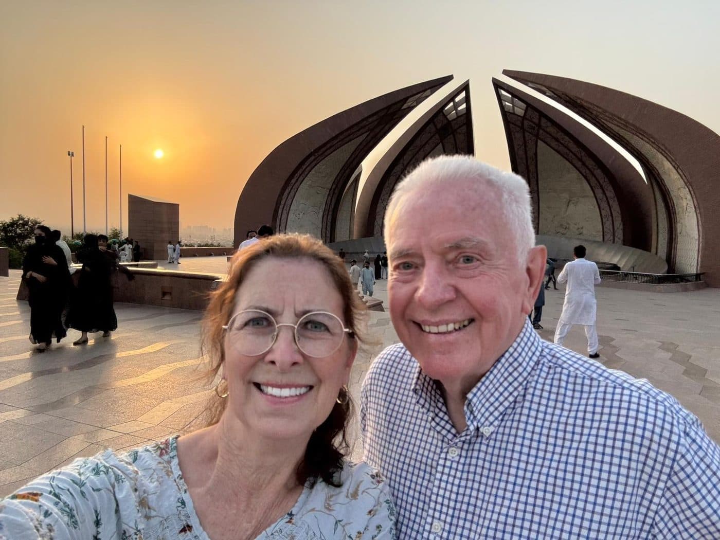Travellers at the Pakistan Monument in Islamabad at sunset, its four petals representing the provinces