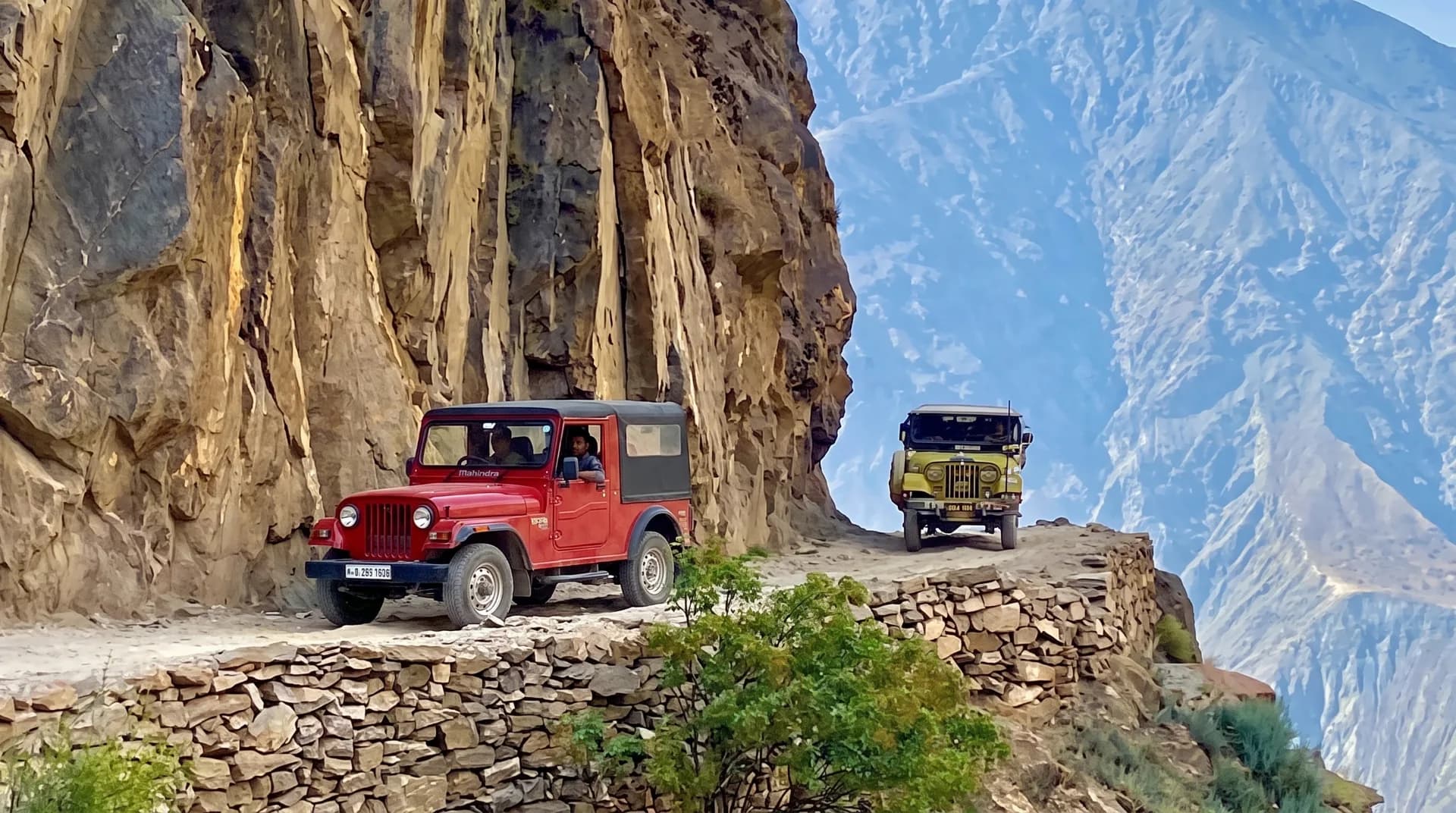 A rugged 4x4 local jeep navigating the steep and dangerous dirt track to Fairy Meadows in northern Pakistan