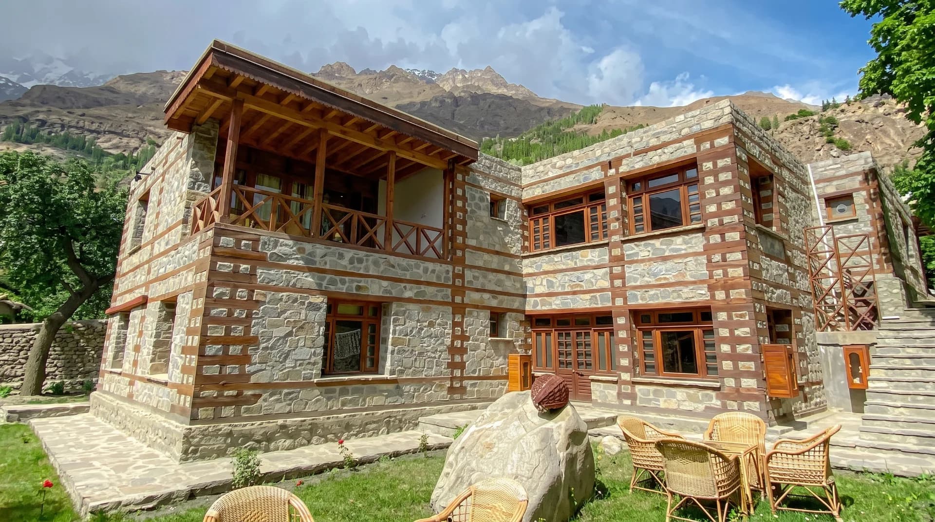 A comfortable mid-range hotel room with a balcony overlooking the mountains in Karimabad, Hunza Valley