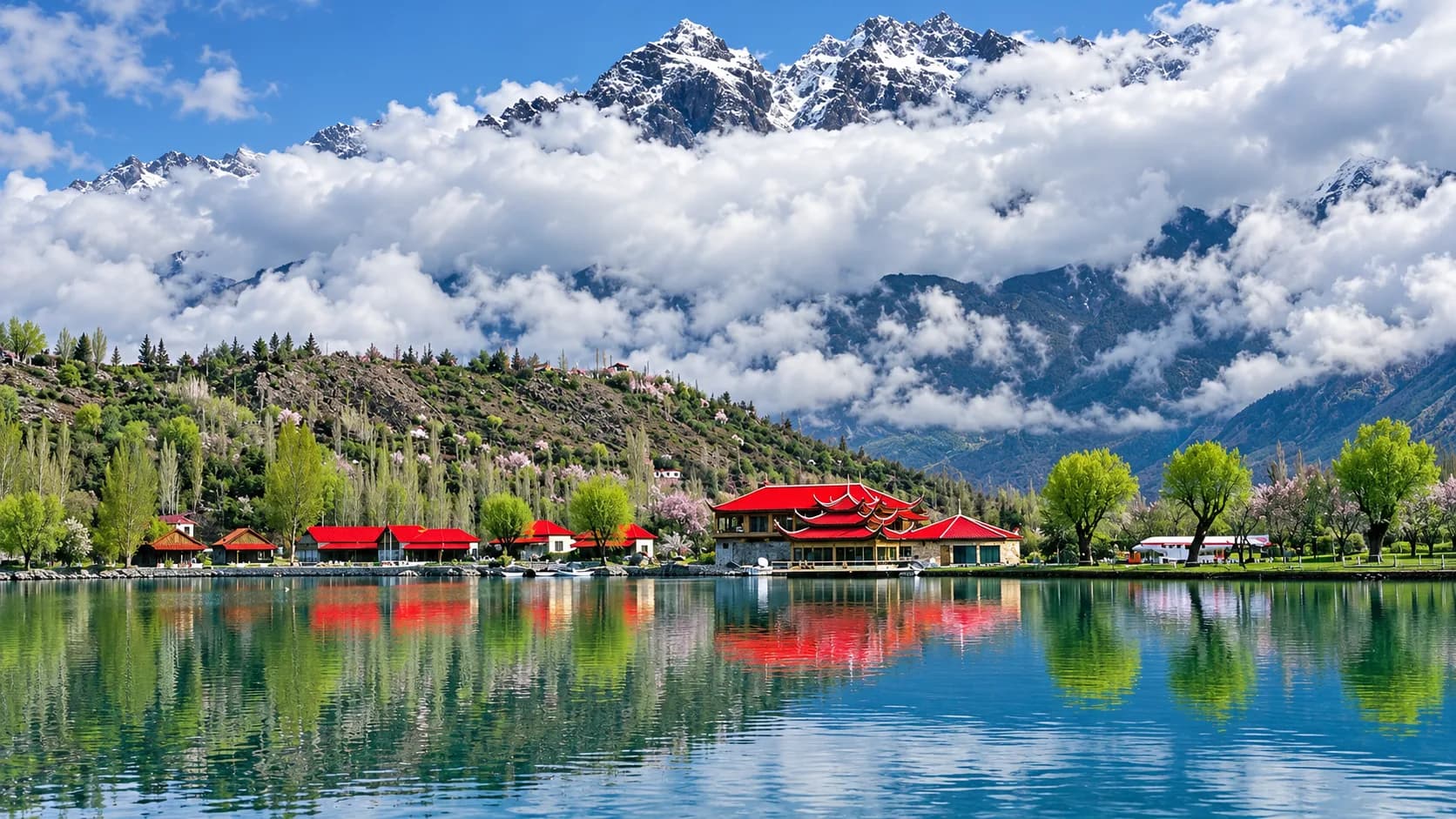 The red-roofed pagoda cottages of Shangrila Resort reflecting on the calm turquoise surface of Lower Kachura Lake in Skardu